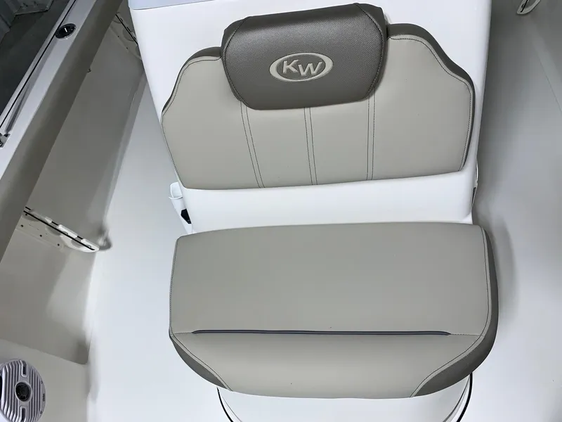 Slide: The Image of Key West 188 Bay Reef 2026 boat seat with KW logo, gray and white upholstery. - 23