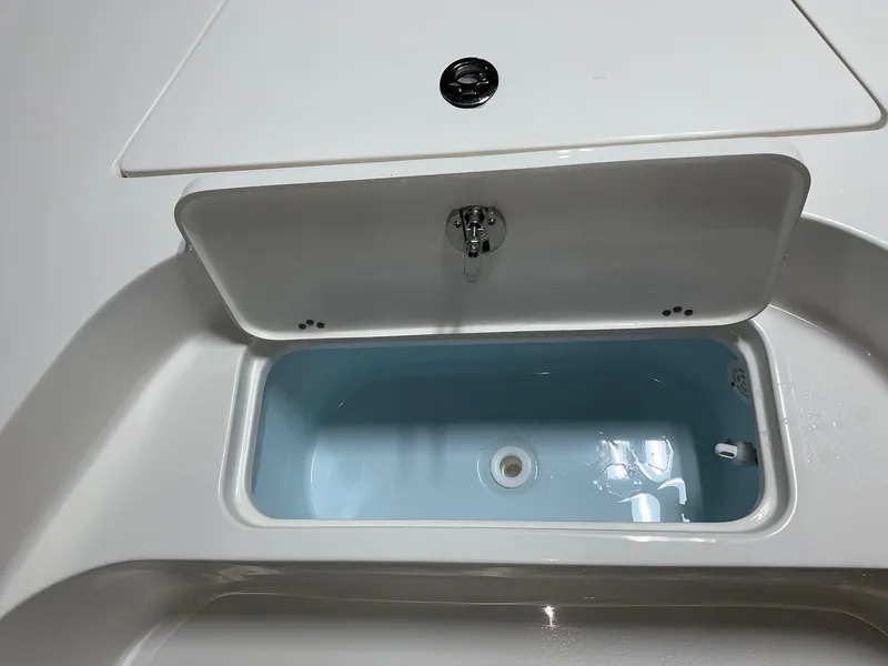 Slide: The Image of Livewell compartment on 2026 Key West 188 Bay Reef boat, open and empty. - 24