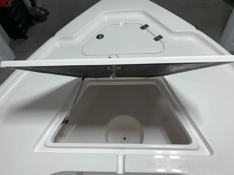 Slide: The Image of 2026 Key West 188 Bay Reef boat with open storage compartment on deck. - 25