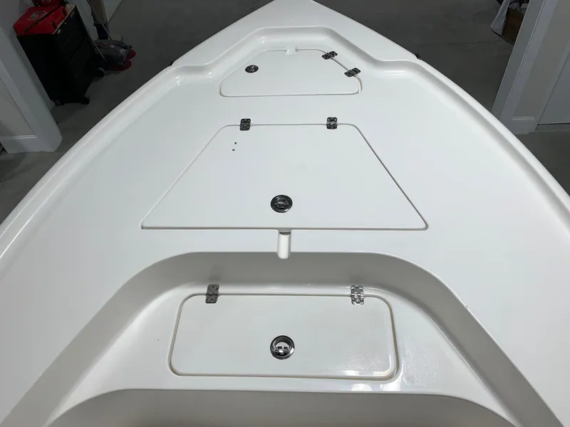 Slide: The Image of 2026 Key West 188 Bay Reef boat deck with storage compartments. - 27