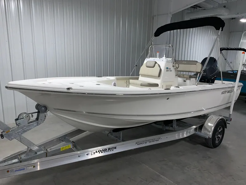 Slide: The Image of 2026 Key West 188 Bay Reef boat on trailer in indoor storage. - 3