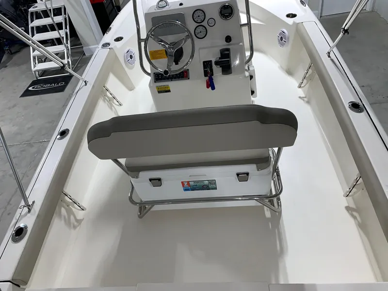 Slide: The Image of 2026 Key West 188 Bay Reef boat interior with steering console and seating. - 5