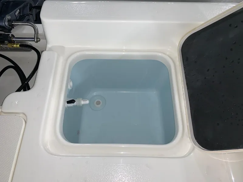 Slide: The Image of Livewell compartment on 2026 Key West 188 Bay Reef boat, open lid view. - 7