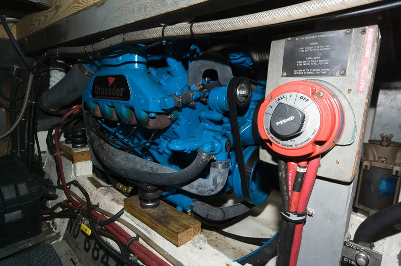 Slide: The Image of 1984 Chris-Craft 350 Catalina engine compartment with blue Crusader engine and wiring. - 19