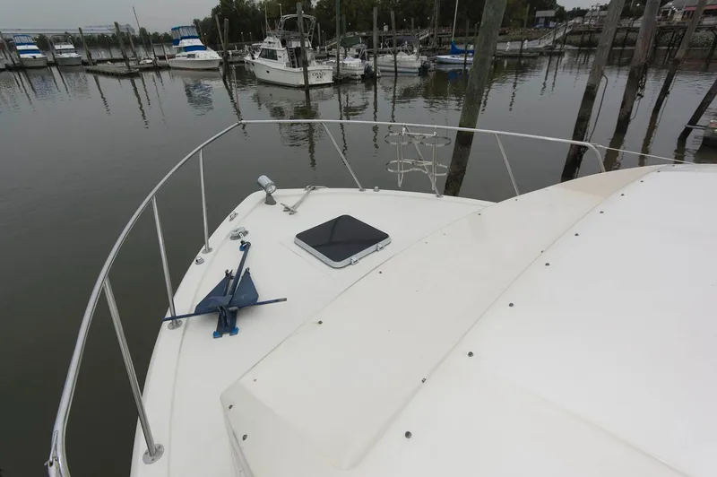 Slide: The Image of 1984 Chris-Craft 350 Catalina yacht docked in a marina, featuring a spacious deck. - 3
