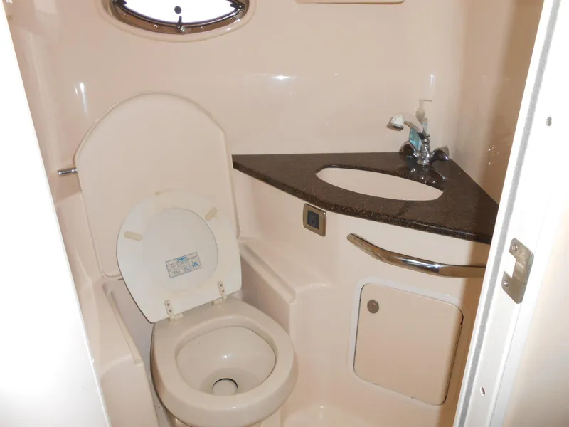Slide: The Image of 2005 Sea Ray 420 Sundancer bathroom with toilet, sink, and countertop. - 20
