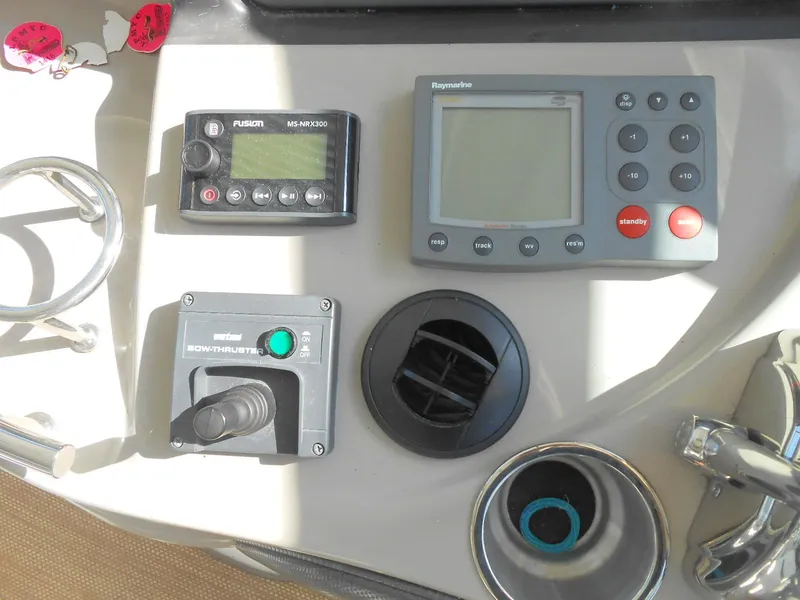 Slide: The Image of Control panel of a 2005 Sea Ray 420 Sundancer with navigation and audio systems. - 27