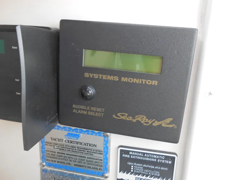 Slide: The Image of Sea Ray 420 Sundancer 2005 systems monitor with yacht certification and fire extinguishing system labels. - 28