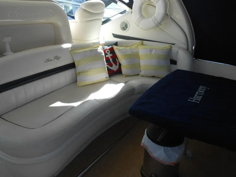 Slide: The Image of 2005 Sea Ray 420 Sundancer interior with white seating and striped cushions. - 30