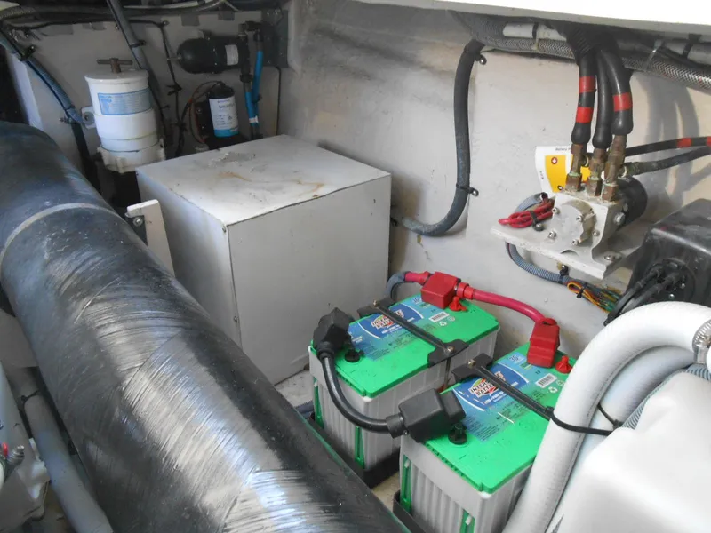 Slide: The Image of Engine room of 2005 Sea Ray 420 Sundancer with batteries and mechanical components. - 38