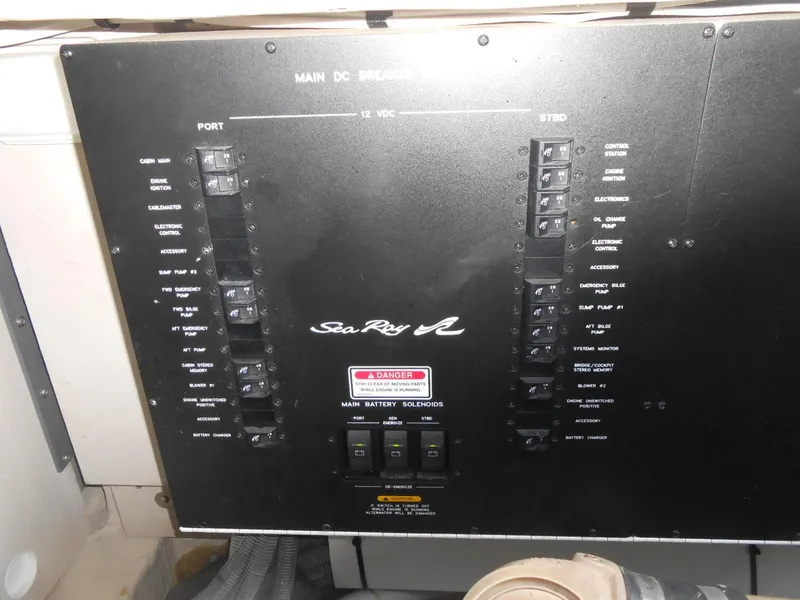 Slide: The Image of Main control panel of 2005 Sea Ray 420 Sundancer boat with switches and labels. - 42