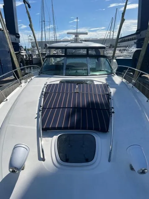 Slide: The Image of 2005 Sea Ray 420 Sundancer yacht docked at a marina. - 46