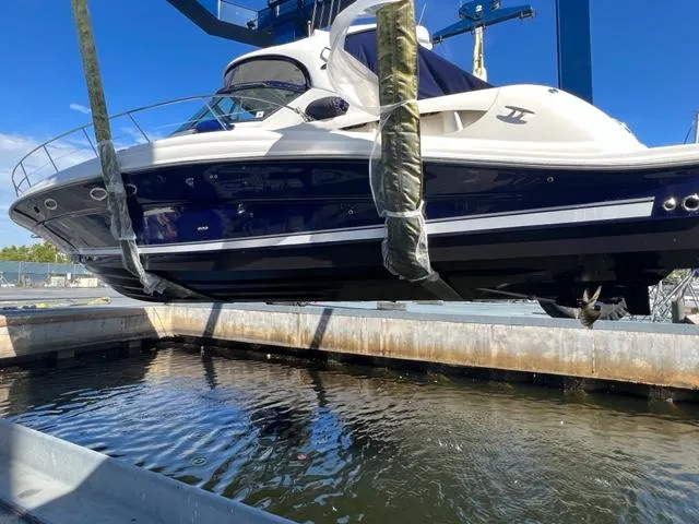 Slide: The Image of 2005 Sea Ray 420 Sundancer being lifted from water at marina. - 48