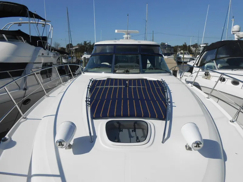 Slide: The Image of 2005 Sea Ray 420 Sundancer yacht docked at marina, front deck view. - 5