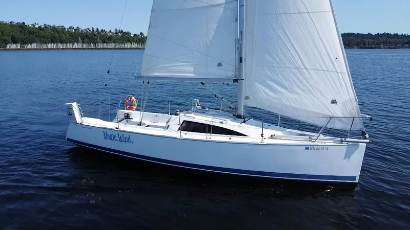 The Image of 2015 Catalina 275 Sport sailboat on calm water with white sails. - 0