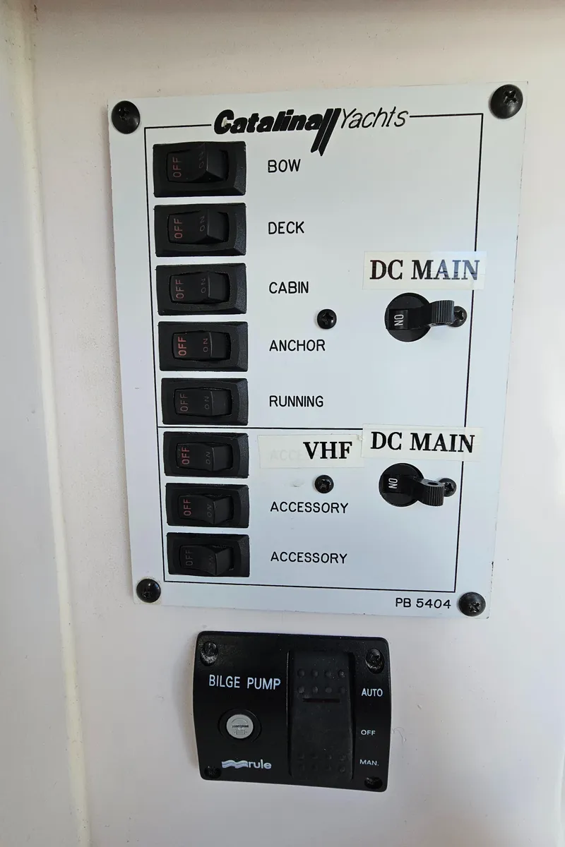 Slide: The Image of Control panel of a 2015 Catalina 275 Sport yacht with labeled switches and bilge pump. - 5