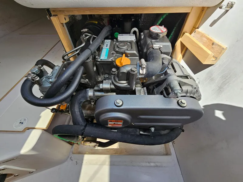Slide: The Image of Engine compartment of a 2015 Catalina 275 Sport sailboat, showcasing detailed mechanical components. - 7