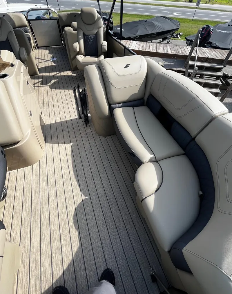 Slide: The Image of 2024 Starcraft SLS 3 pontoon boat with luxurious seating and spacious deck. - 11
