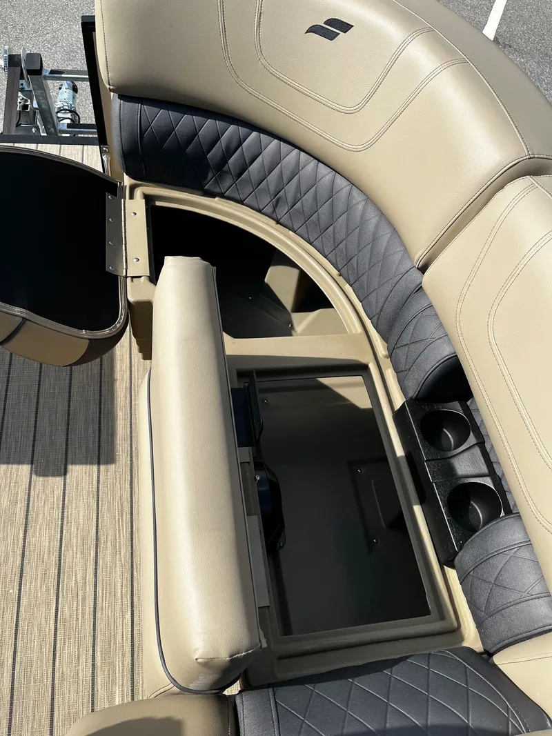Slide: The Image of 2024 Starcraft SLS 3 boat interior with storage compartment and cup holders. - 12