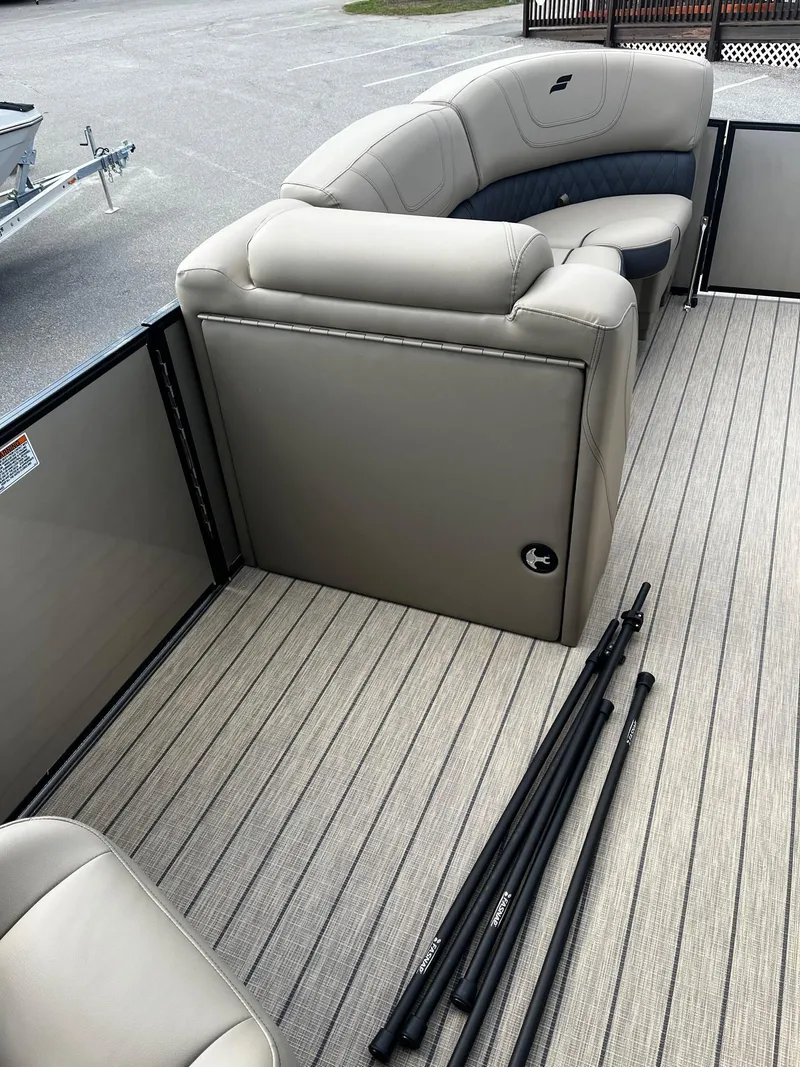 Slide: The Image of 2024 Starcraft SLS 3 pontoon boat interior with beige seating and deck. - 8