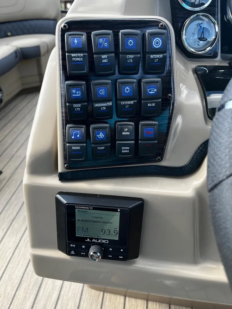 Slide: The Image of Control panel and audio system of 2024 Starcraft SLS 3 boat. - 7