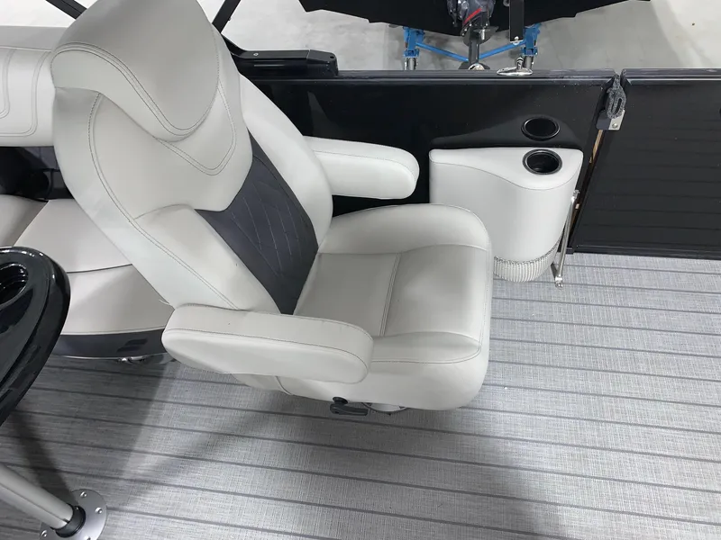 Slide: The Image of 2024 Starcraft SLS 3 Q DH boat interior with premium seating and cup holders. - 8