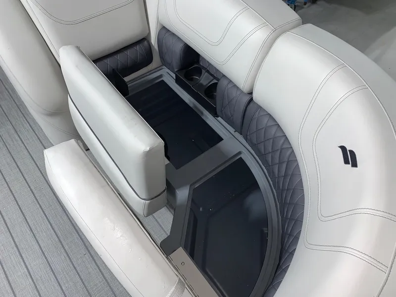 Slide: The Image of 2024 Starcraft SLS 3 Q DH boat interior seating with storage compartments. - 10