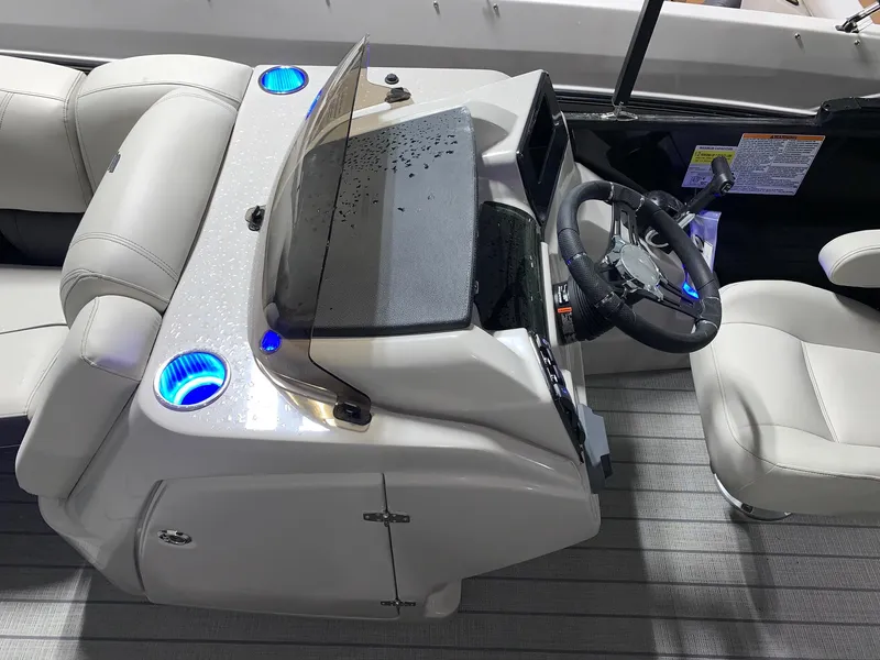 Slide: The Image of 2024 Starcraft SLS 3 Q DH boat helm with illuminated cup holders and modern controls. - 8