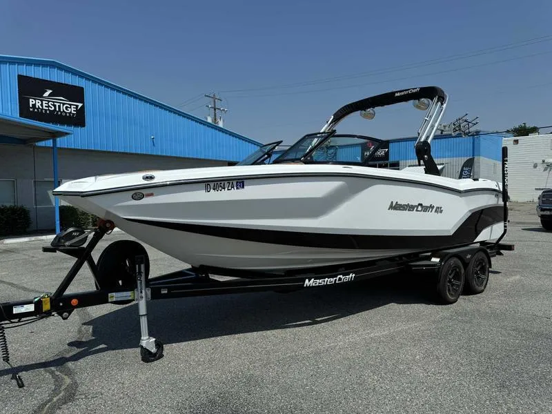 Slide: The Image of 2021 MasterCraft NXT24 boat on trailer outside Prestige dealership. - 12