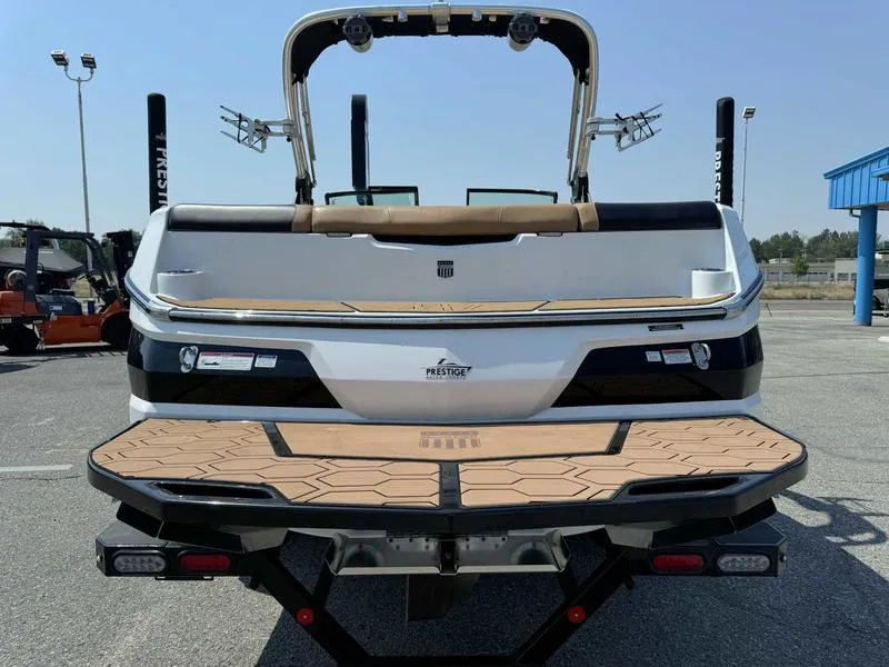 Slide: The Image of 2021 MasterCraft NXT24 boat rear view with swim platform. - 6