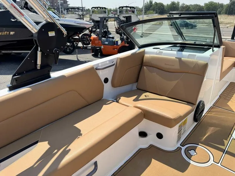 Slide: The Image of 2021 MasterCraft NXT24 boat interior with tan seating and modern design. - 7