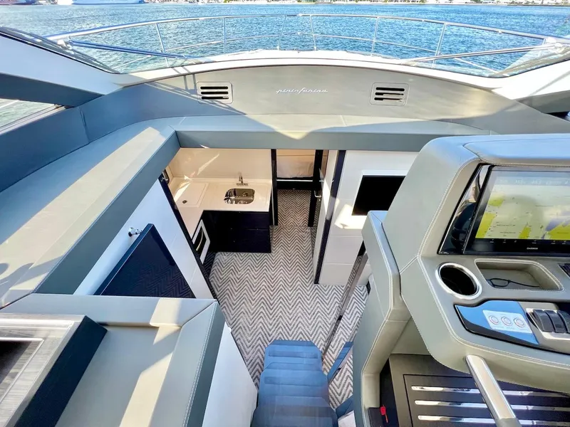 Slide: The Image of Interior of 2025 Schaefer 510 Sport yacht with modern kitchen and navigation system. - 16
