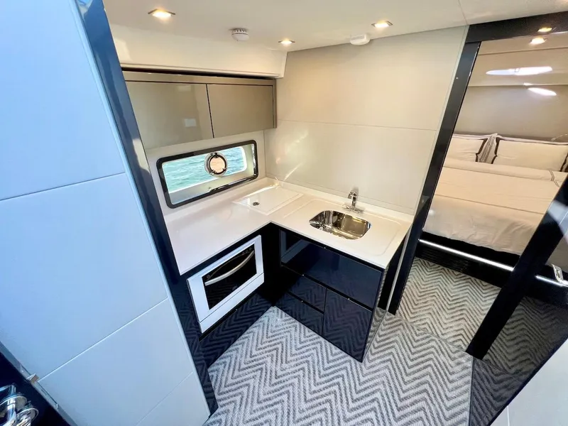 Slide: The Image of Modern kitchen and bedroom interior of 2025 Schaefer 510 Sport yacht. - 19