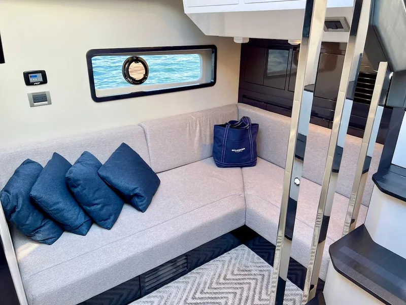 Slide: The Image of Interior of 2025 Schaefer 510 Sport yacht with modern seating and ocean view. - 33