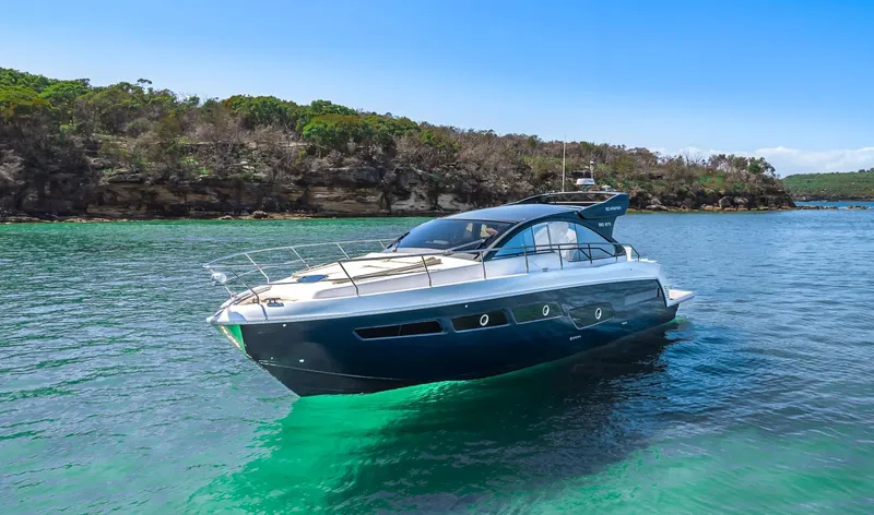 The Image of 2025 Schaefer 510 Sport yacht cruising in clear blue waters. - 0