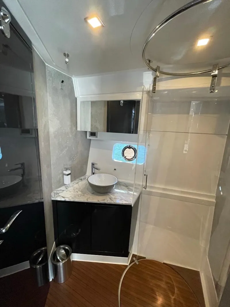 Slide: The Image of Modern bathroom in 2025 Schaefer 510 Sport yacht with marble countertop and vessel sink. - 30