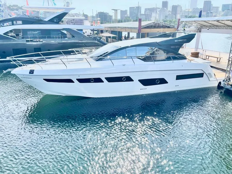 Slide: The Image of 2025 Schaefer 510 Sport yacht docked at marina, side view. - 39