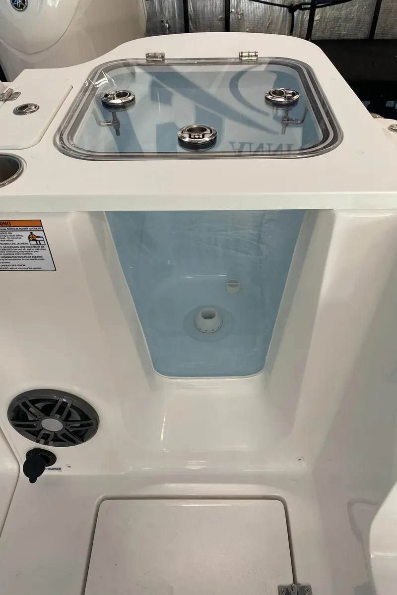 Slide: The Image of 2025 Sea Fox 268 Commander livewell with clear lid and stainless steel latches. - 11