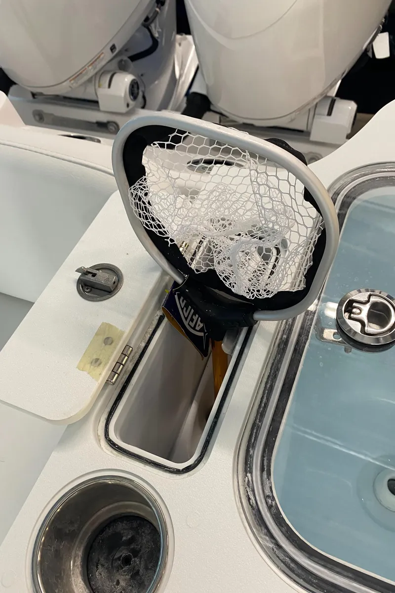 Slide: The Image of 2025 Sea Fox 268 Commander boat deck with fishing net and storage compartments. - 12