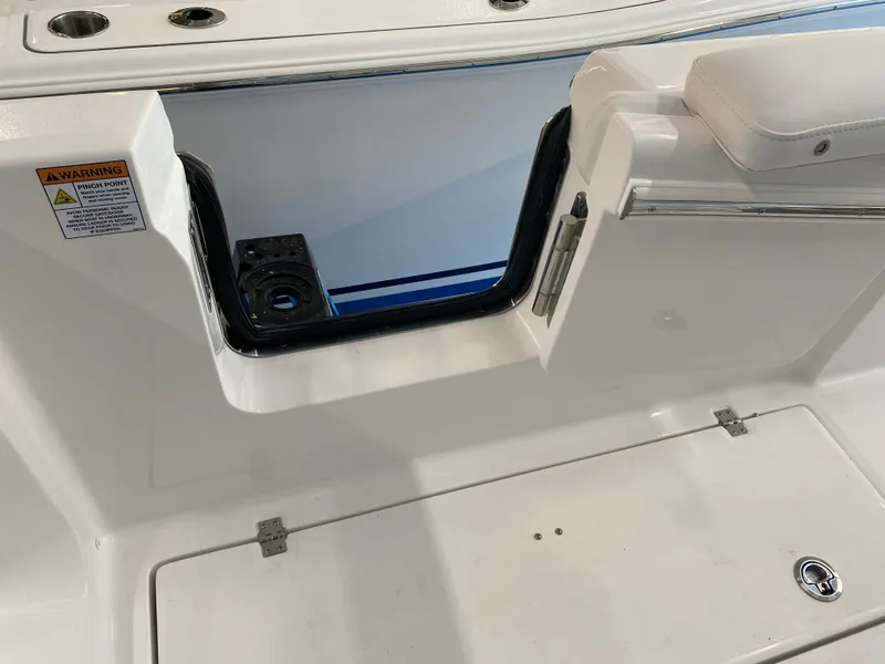 Slide: The Image of Sea Fox 268 Commander 2025 boat interior with open hatch and seating area. - 14