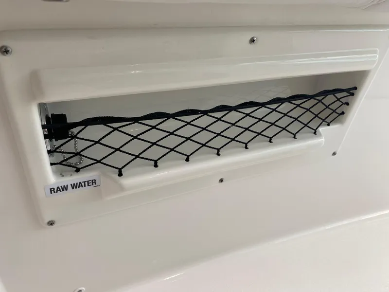 Slide: The Image of Sea Fox 268 Commander 2025 raw water compartment with netting. - 18