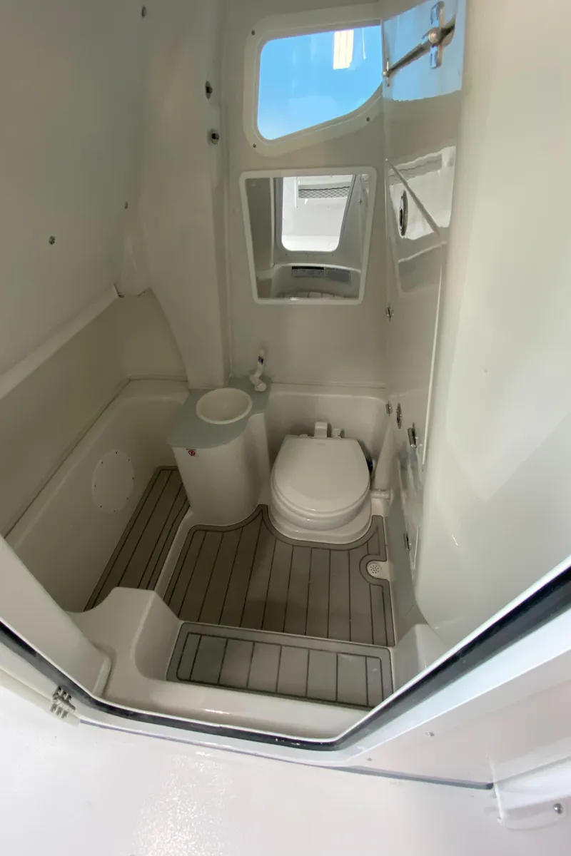 Slide: The Image of 2025 Sea Fox 268 Commander boat bathroom interior with toilet and sink. - 19