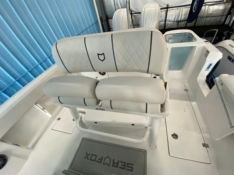 Slide: The Image of 2025 Sea Fox 268 Commander boat interior with white cushioned seating. - 27