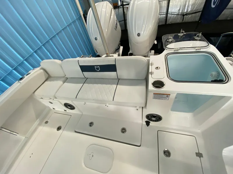 Slide: The Image of 2025 Sea Fox 268 Commander boat interior with seating and dual engines. - 8