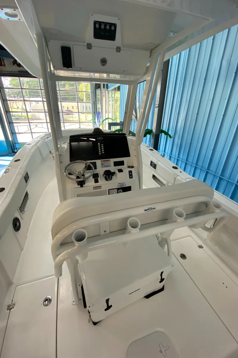 Slide: The Image of 2025 Sea Fox 268 Commander boat interior with helm and seating. - 9