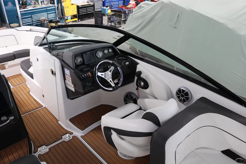 Slide: The Image of 2018 Monterey M-65 boat interior with sleek dashboard and comfortable seating. - 11