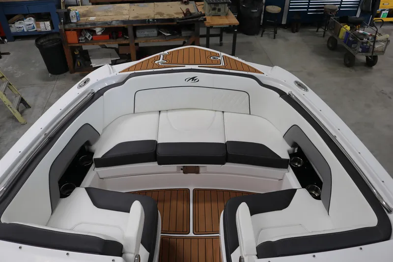 Slide: The Image of Luxurious 2018 Monterey M-65 boat interior with cushioned seating and teak flooring. - 15