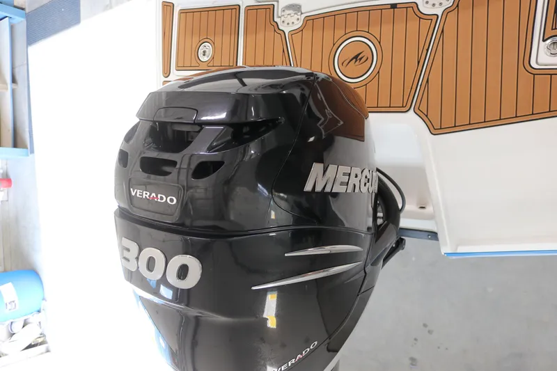 Slide: The Image of Outboard motor on a 2018 Monterey M-65 boat, featuring a Mercury Verado 300 engine. - 18