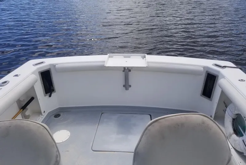 Slide: The Image of 1977 Pace Wahoo boat interior with seating, on calm water. - 10