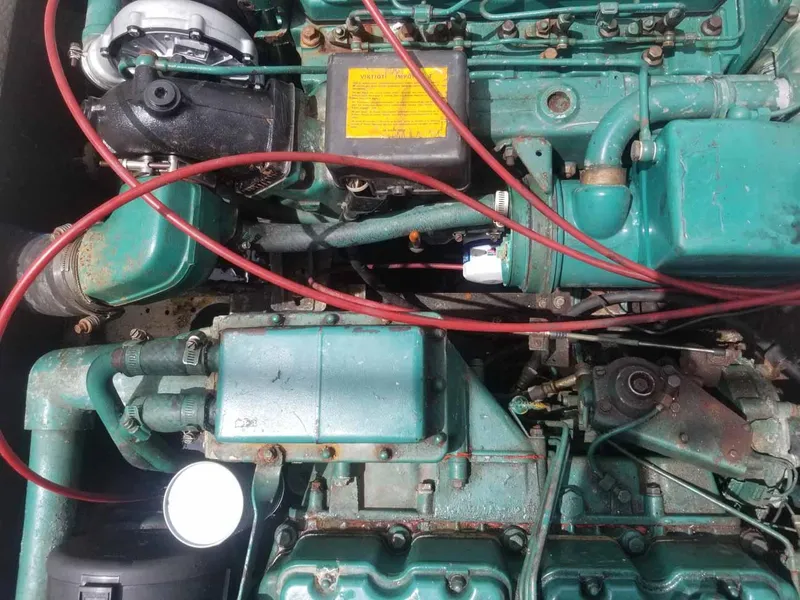 Slide: The Image of Close-up of a 1977 Pace Wahoo engine with visible components and wiring. - 14